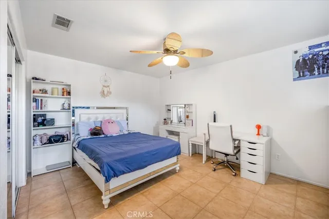 a bedroom with a bed and cabinets