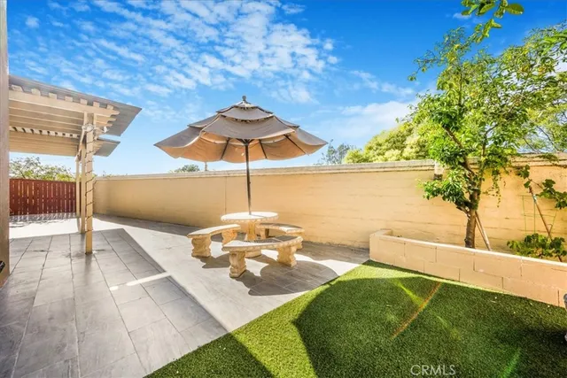 a view of a swimming pool with a patio