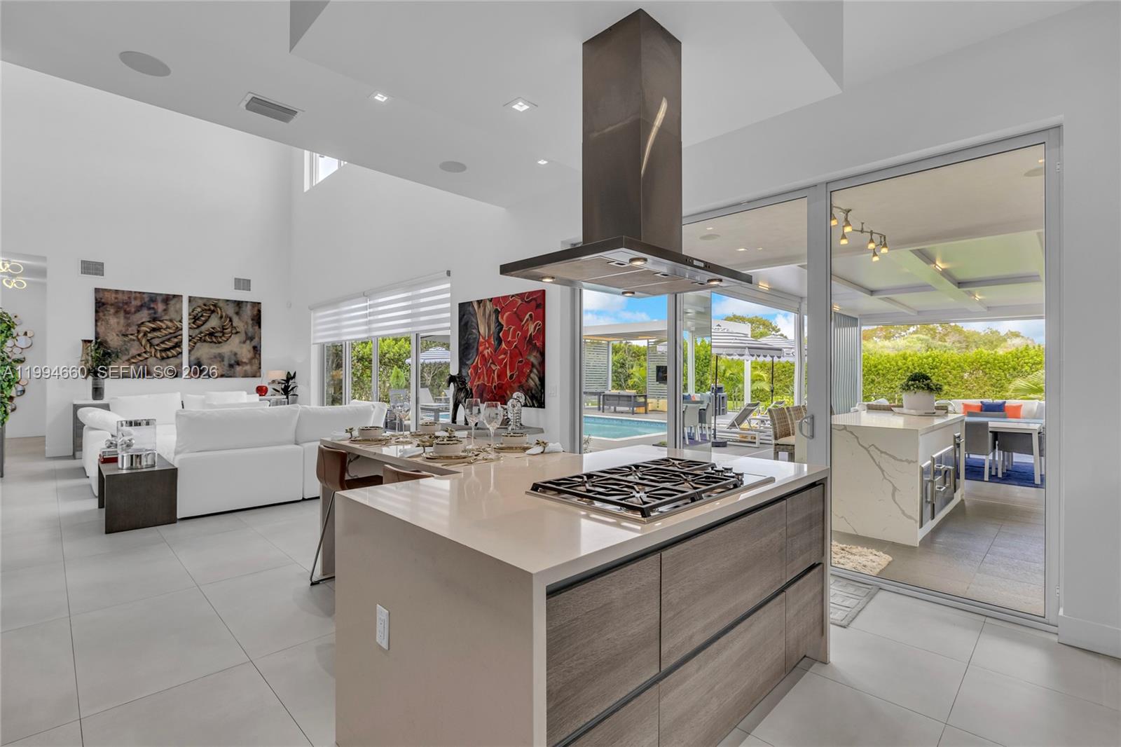 16631 Sunset Way Weston, FL 33326 - Photo 11 of 59 a kitchen with a table and chairs in it