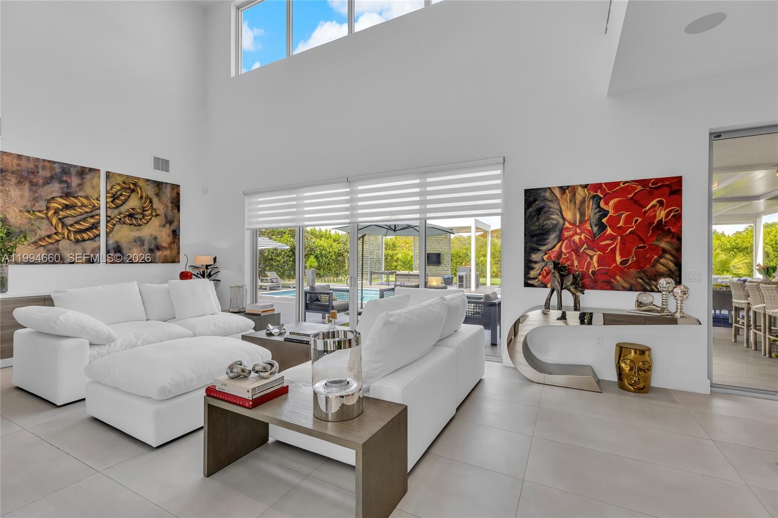 16631 Sunset Way Weston, FL 33326 - Photo 12 of 59 a living room with furniture and a flat screen tv