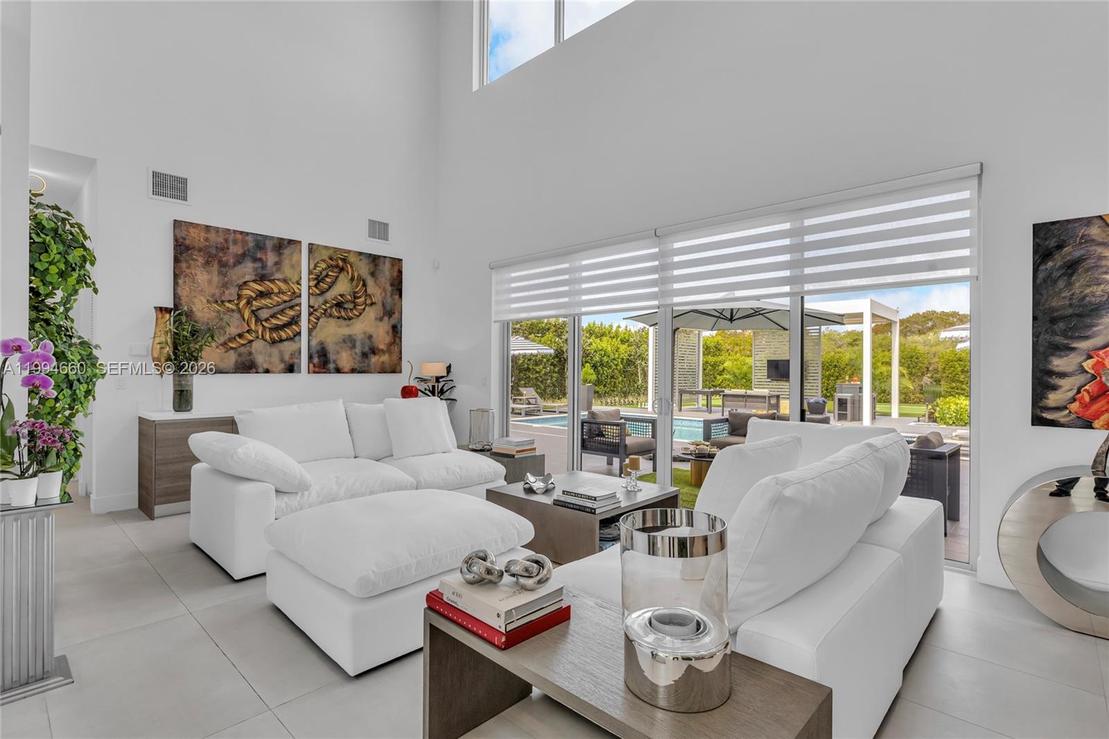16631 Sunset Way Weston, FL 33326 - Photo 14 of 59 a living room with furniture and a large window