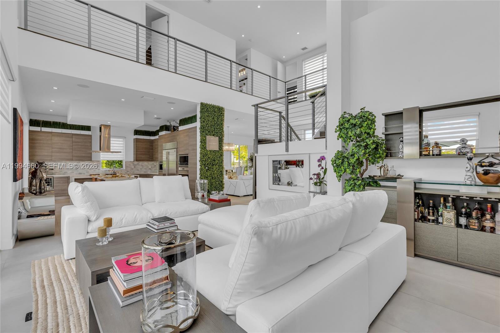 16631 Sunset Way Weston, FL 33326 - Photo 15 of 59 a living room with furniture and kitchen view