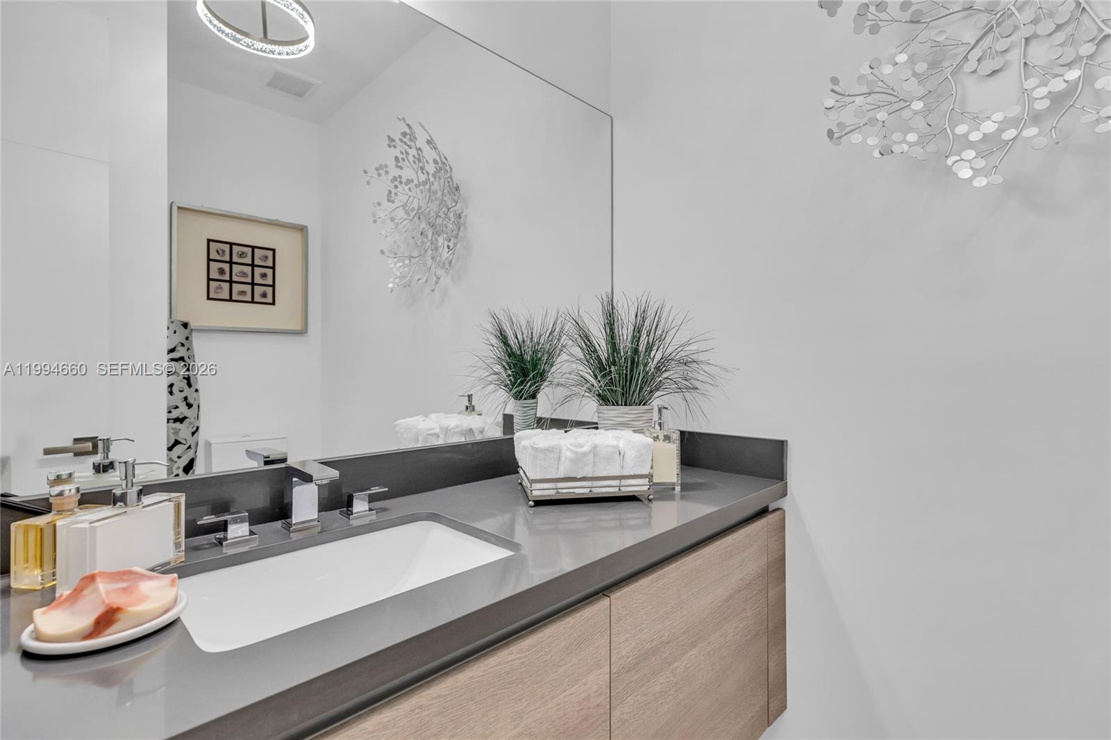 16631 Sunset Way Weston, FL 33326 - Photo 16 of 59 a close view of dining table with potted plant