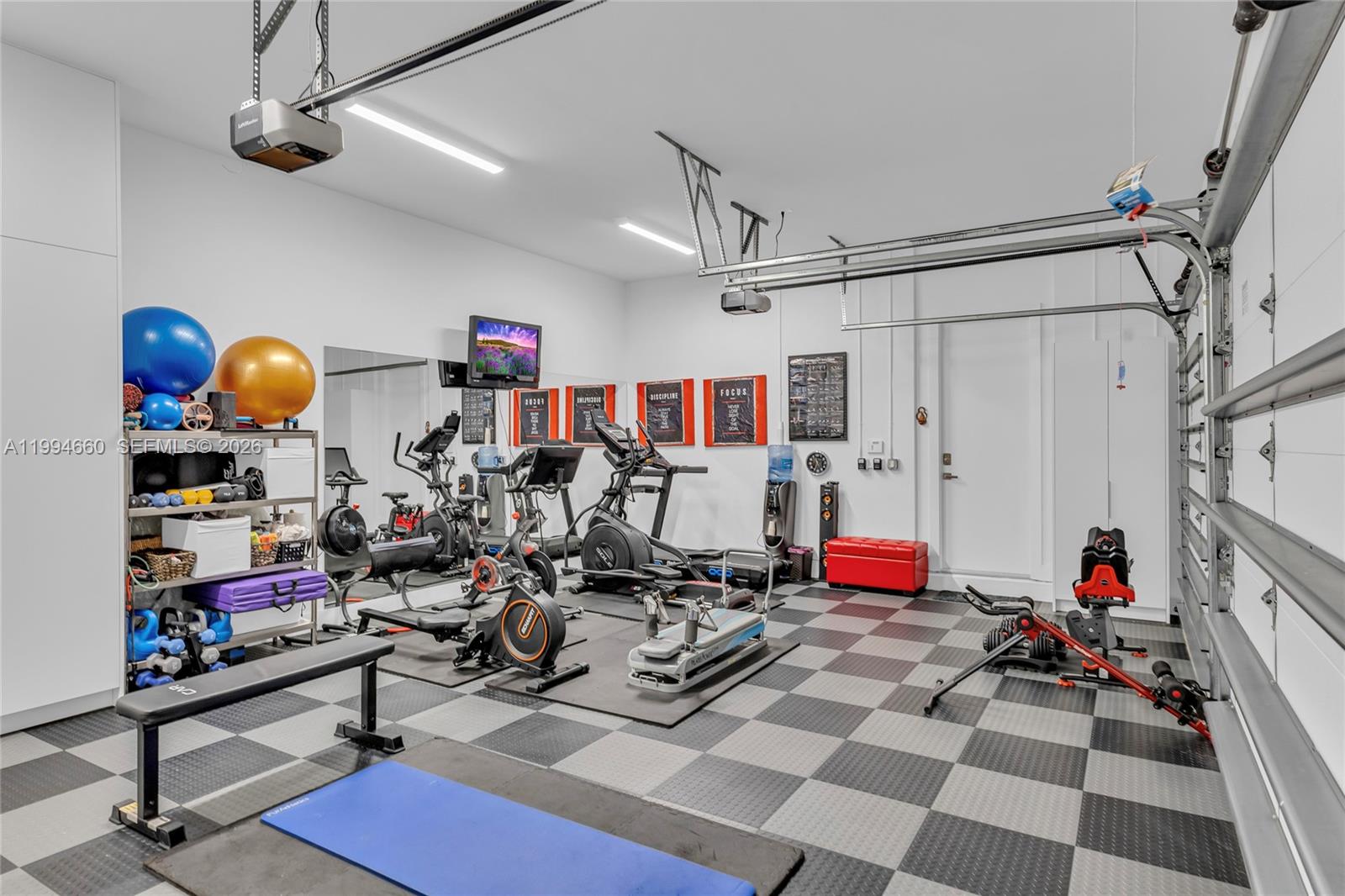 16631 Sunset Way Weston, FL 33326 - Photo 20 of 59 a view of a room with gym equipment