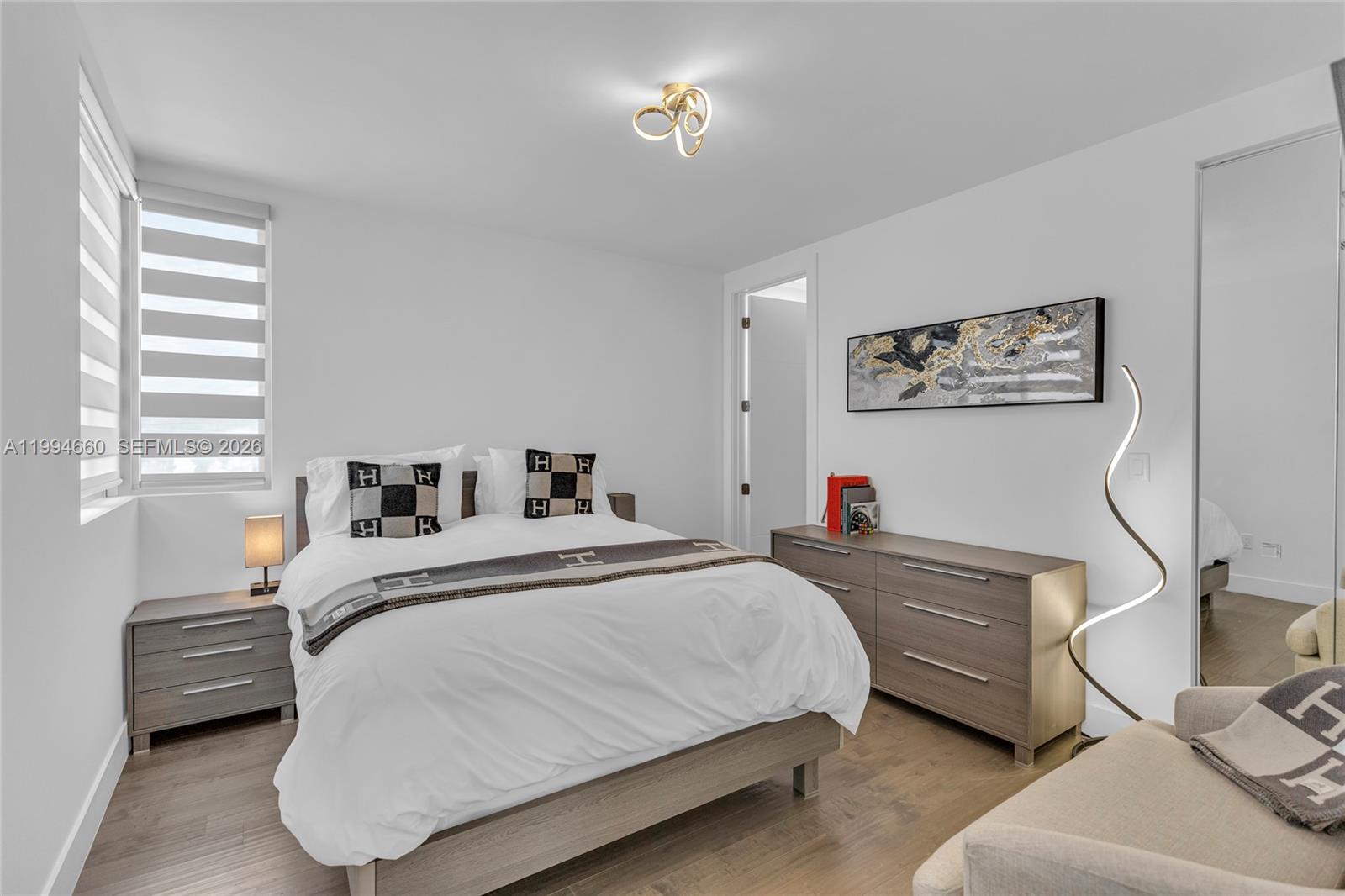 16631 Sunset Way Weston, FL 33326 - Photo 28 of 59 a bedroom with a bed and a window