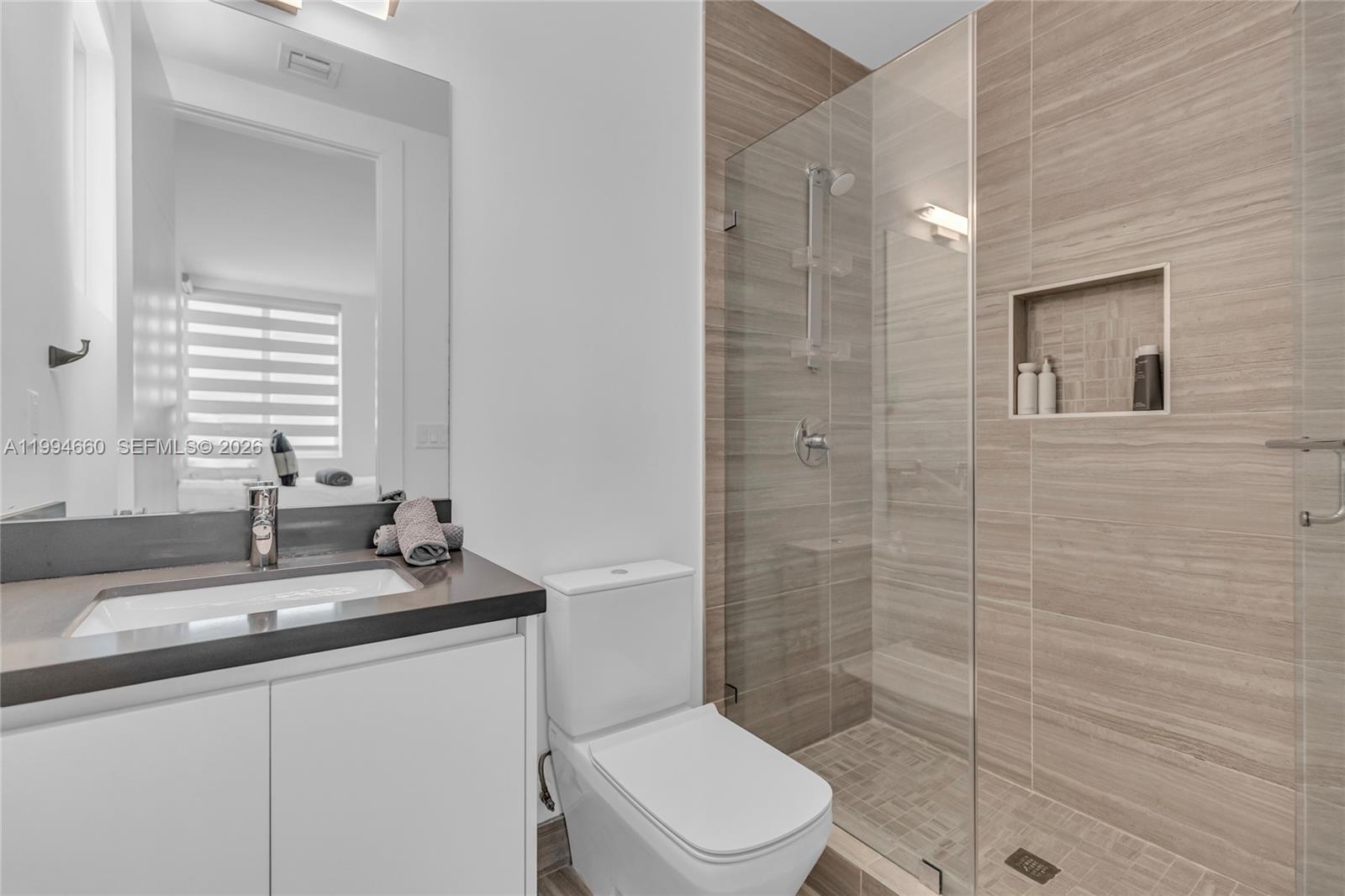 16631 Sunset Way Weston, FL 33326 - Photo 29 of 59 a bathroom with a sink a toilet and shower