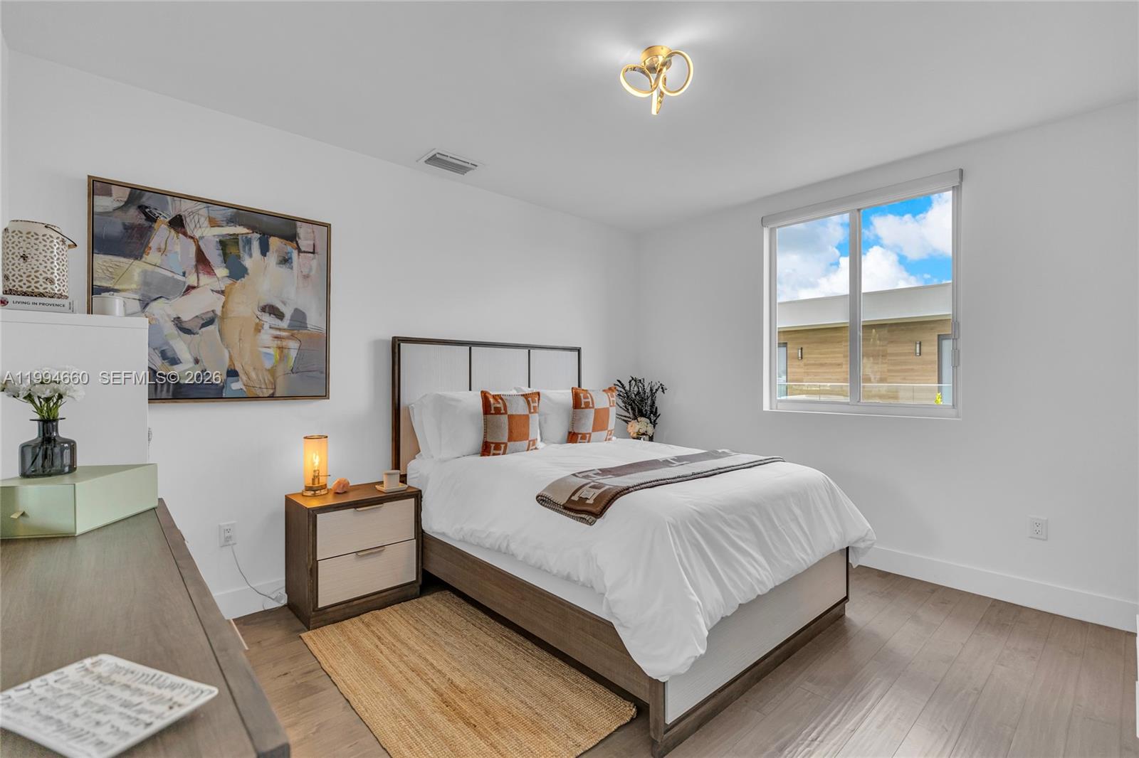 16631 Sunset Way Weston, FL 33326 - Photo 30 of 59 a bedroom with a bed and a window