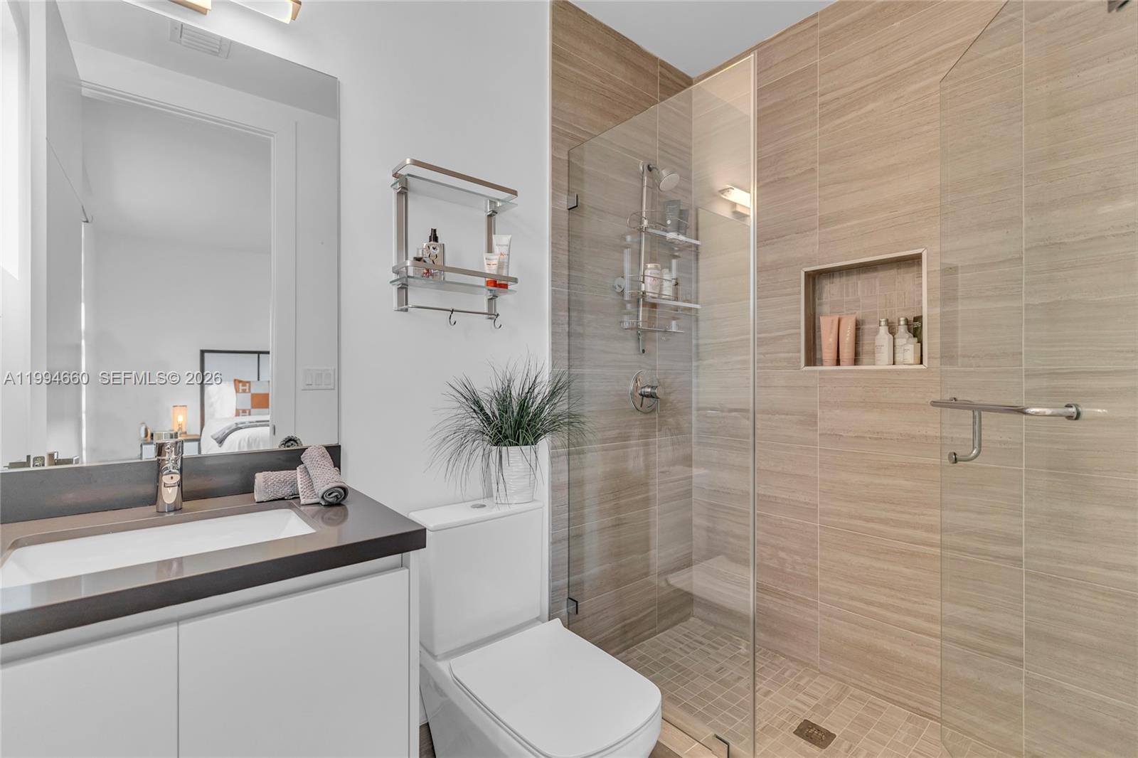 16631 Sunset Way Weston, FL 33326 - Photo 31 of 59 a bathroom with a sink a toilet and shower