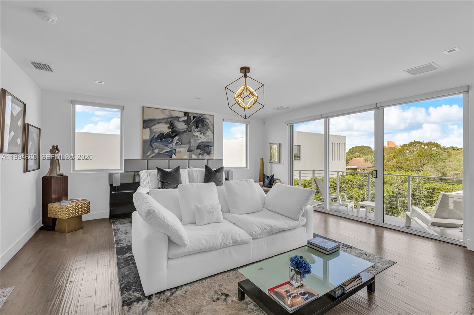16631 Sunset Way Weston, FL 33326 - Photo 32 of 59 a living room with furniture and a large window