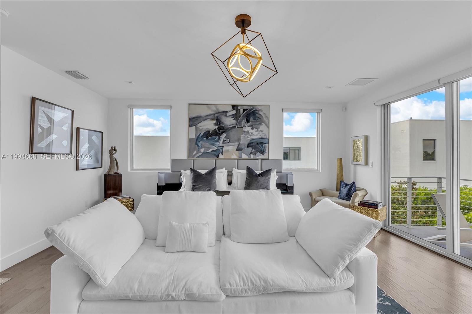 16631 Sunset Way Weston, FL 33326 - Photo 35 of 59 a living room with furniture and a large window