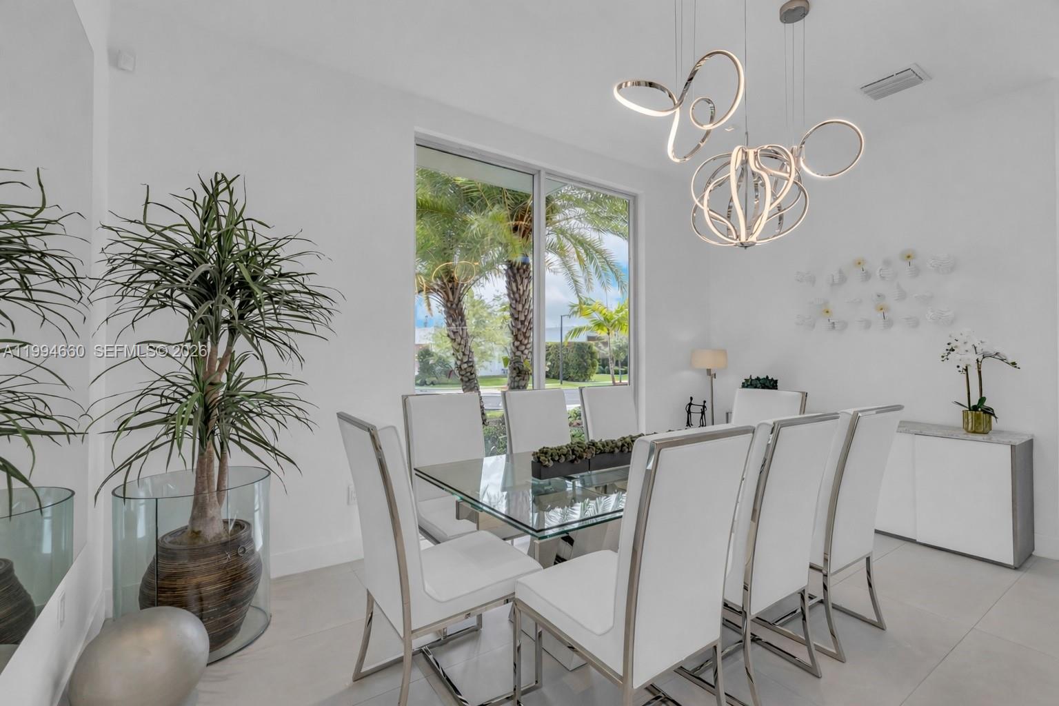 16631 Sunset Way Weston, FL 33326 - Photo 5 of 59 a view of a dining room with furniture window and outside view