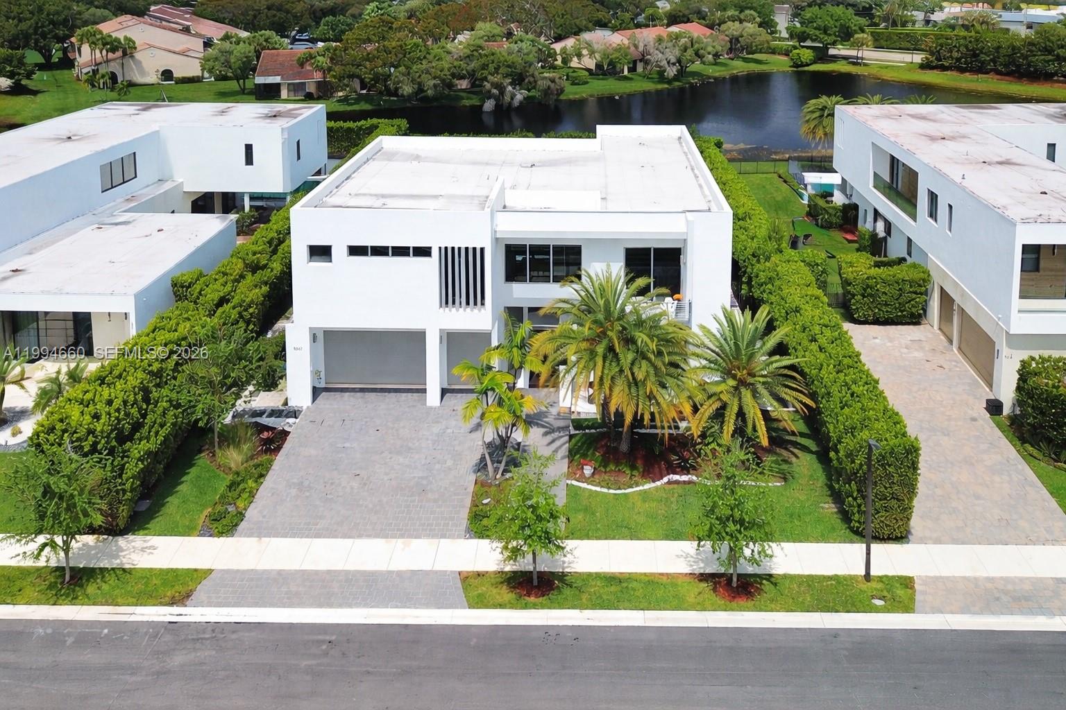 16631 Sunset Way Weston, FL 33326 - Photo 57 of 59 a aerial view of a house with garden space and houses