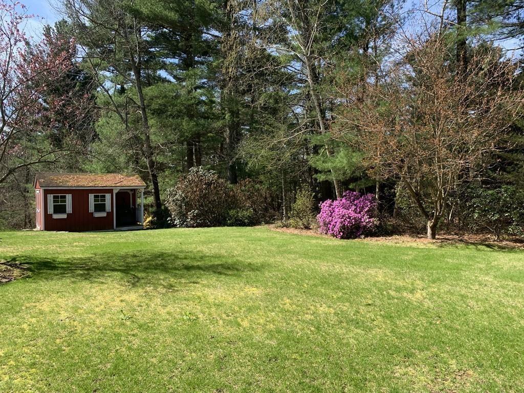 15 Fenton Road Monson, MA 01057 - Photo 18 of 41 a backyard of a house with lots of green space and fountain