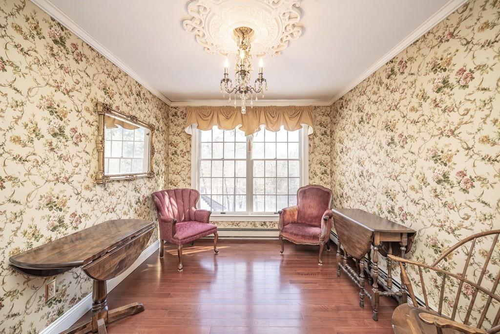 15 Fenton Road Monson, MA 01057 - Photo 36 of 41 a living room with furniture and a chandelier