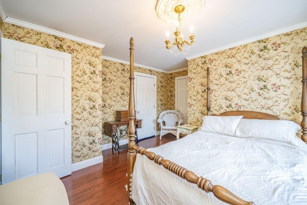 15 Fenton Road Monson, MA 01057 - Photo 39 of 41 a bedroom with a bed and a chandelier
