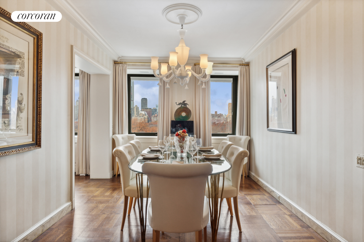 875 5th Avenue, Unit 12B Manhattan, NY 10065 - Photo 7 of 23 a view of a dining room with furniture wooden floor and chandelier