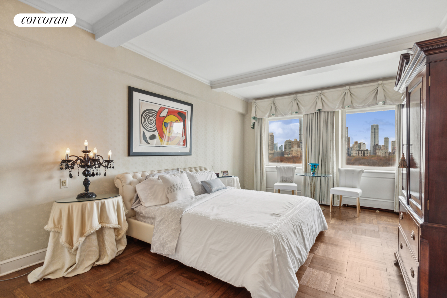 875 5th Avenue, Unit 12B Manhattan, NY 10065 - Photo 13 of 23 a spacious bedroom with a bed and glass door