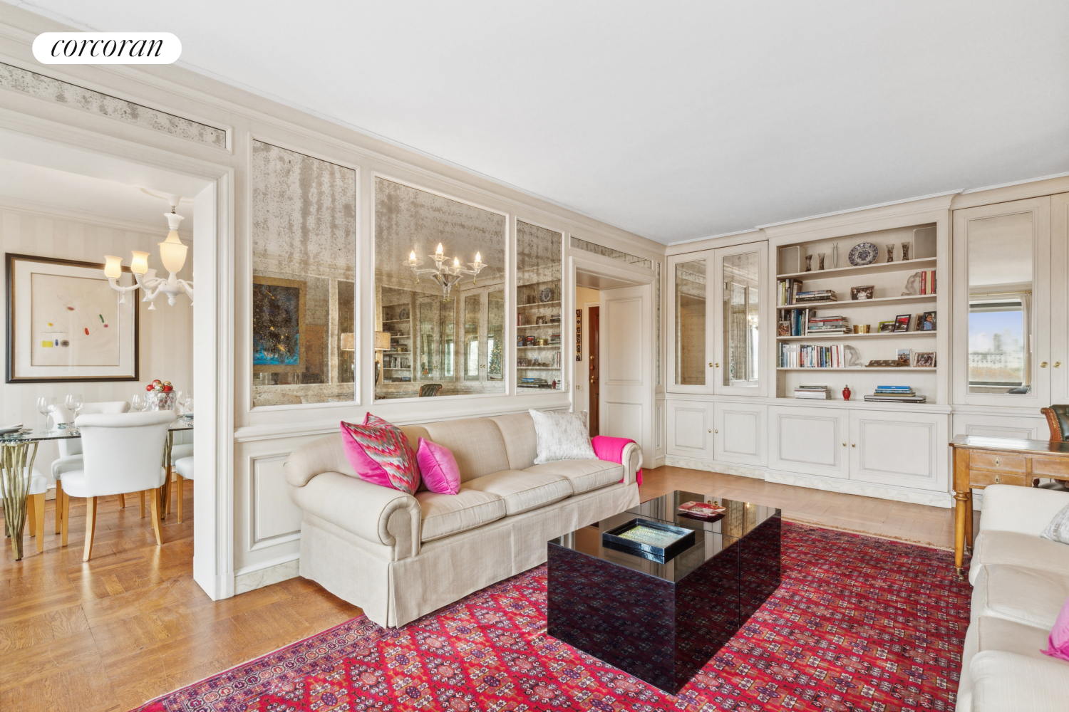 875 5th Avenue, Unit 12B Manhattan, NY 10065 - Photo 3 of 23 a living room with furniture and a floor to ceiling window