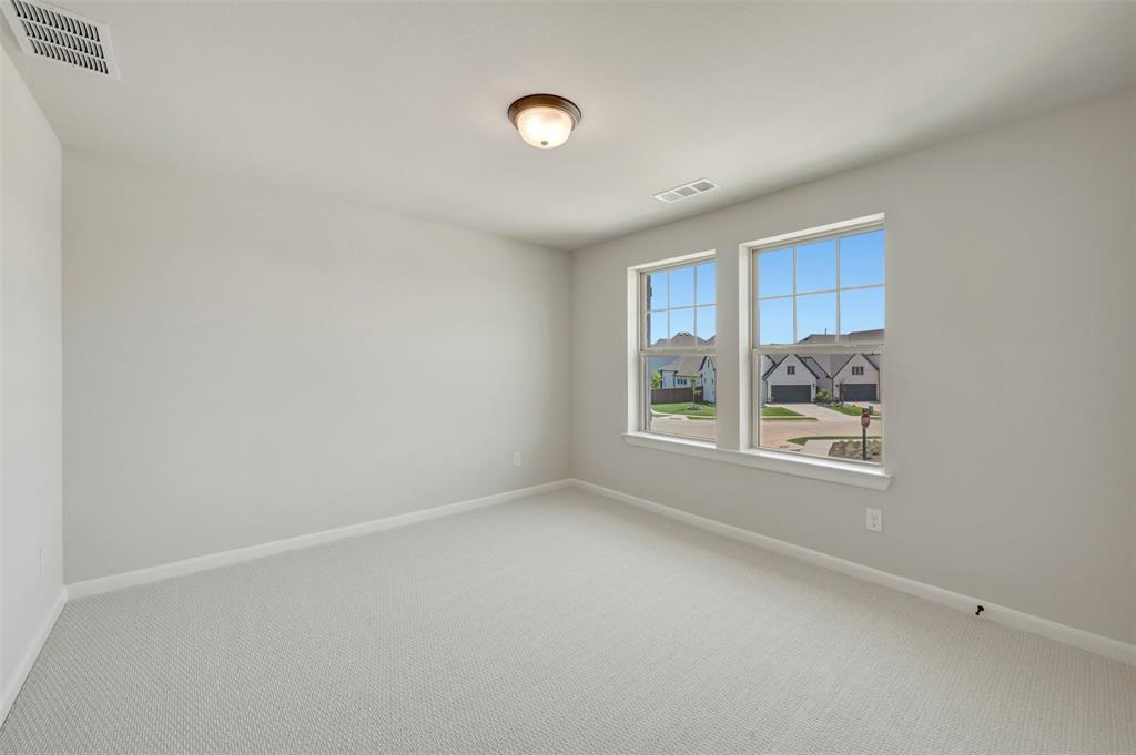4308 Palomino Road Aubrey, TX 76227 - Photo 34 of 40 a view of an empty room with a window