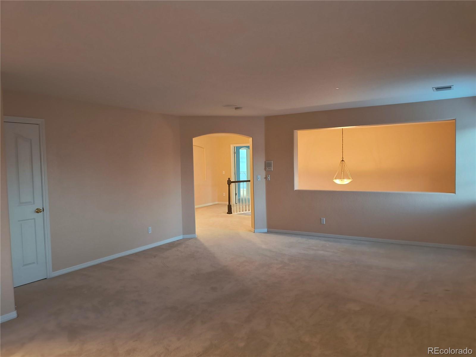 10145 Charissglen Lane Highlands Ranch, CO 80126 - Photo 16 of 39 a view of an empty room with a window