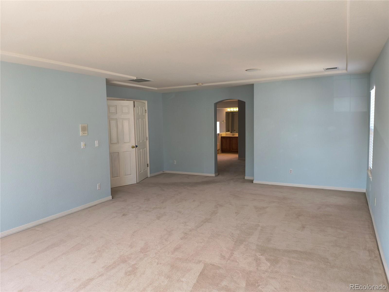 10145 Charissglen Lane Highlands Ranch, CO 80126 - Photo 19 of 39 a view of an empty room with a closet
