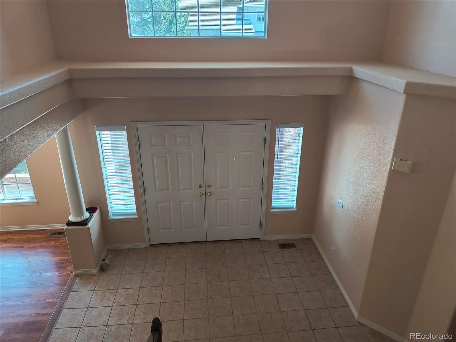 10145 Charissglen Lane Highlands Ranch, CO 80126 - Photo 2 of 39 a view of entryway with a window