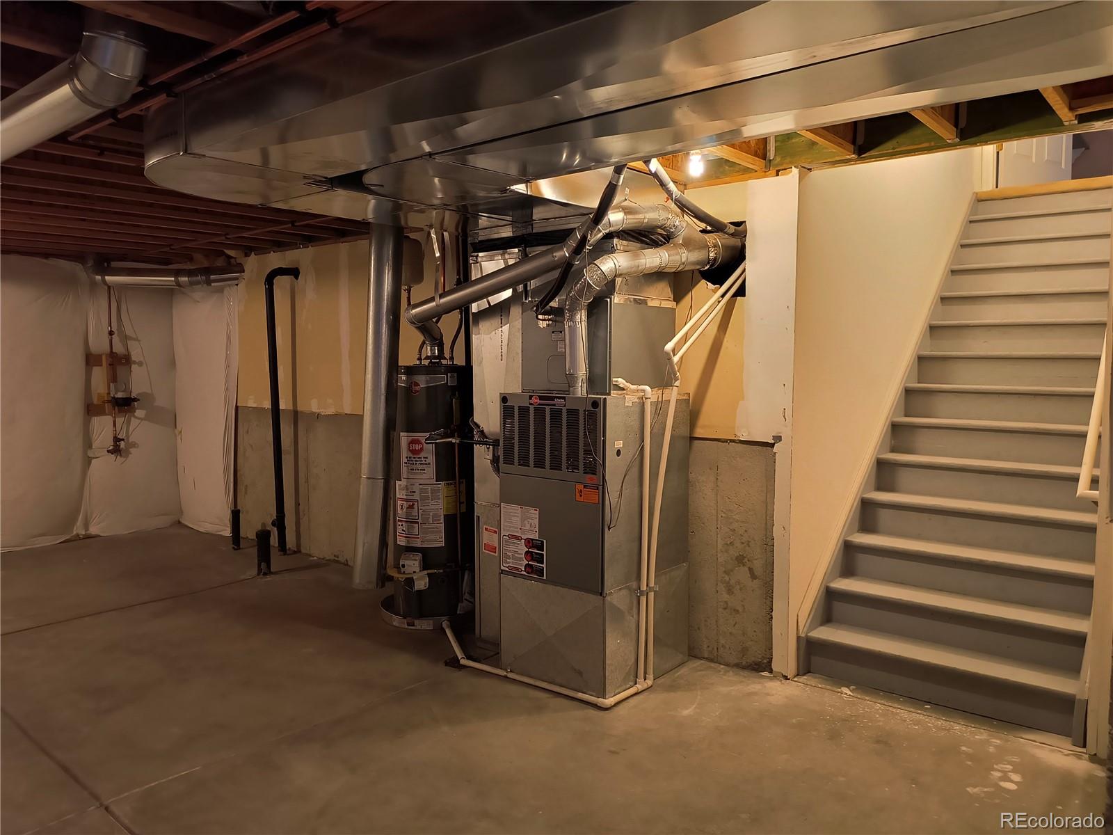 10145 Charissglen Lane Highlands Ranch, CO 80126 - Photo 31 of 39 a view of a room with stairs