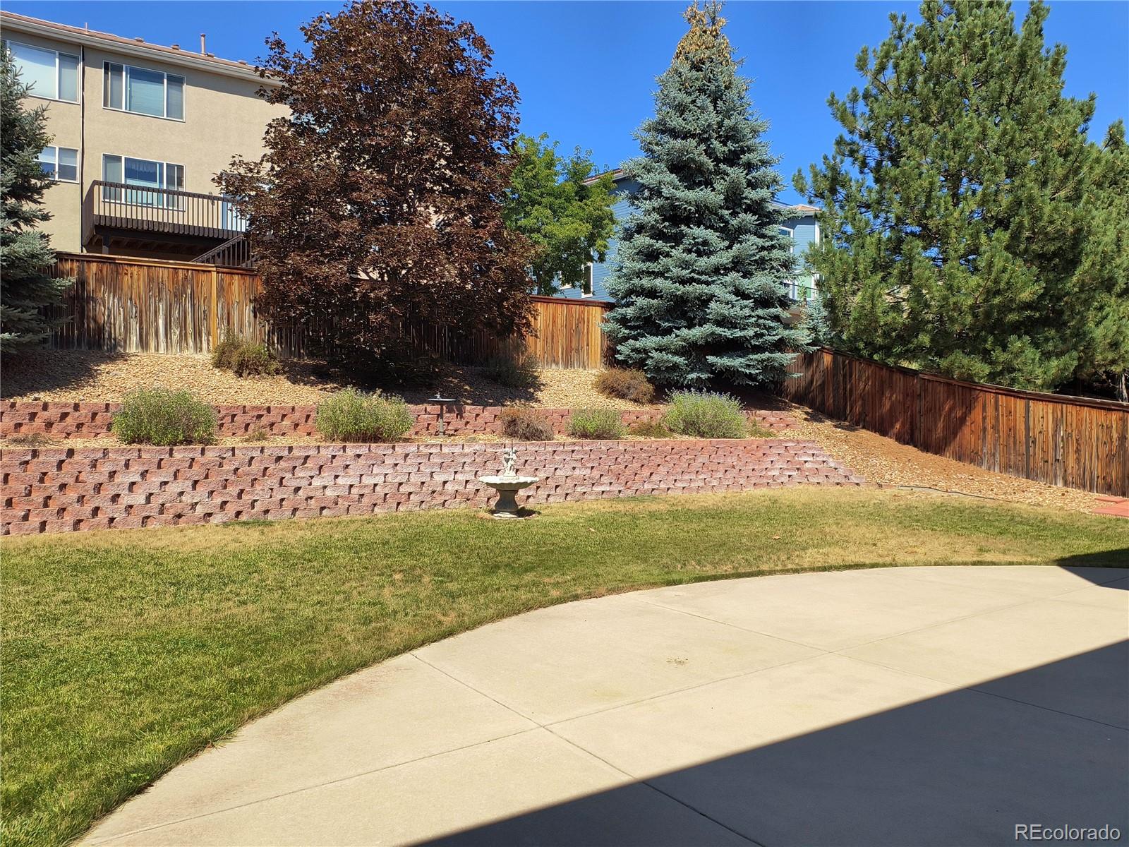 10145 Charissglen Lane Highlands Ranch, CO 80126 - Photo 36 of 39 a view of a yard with flower plants