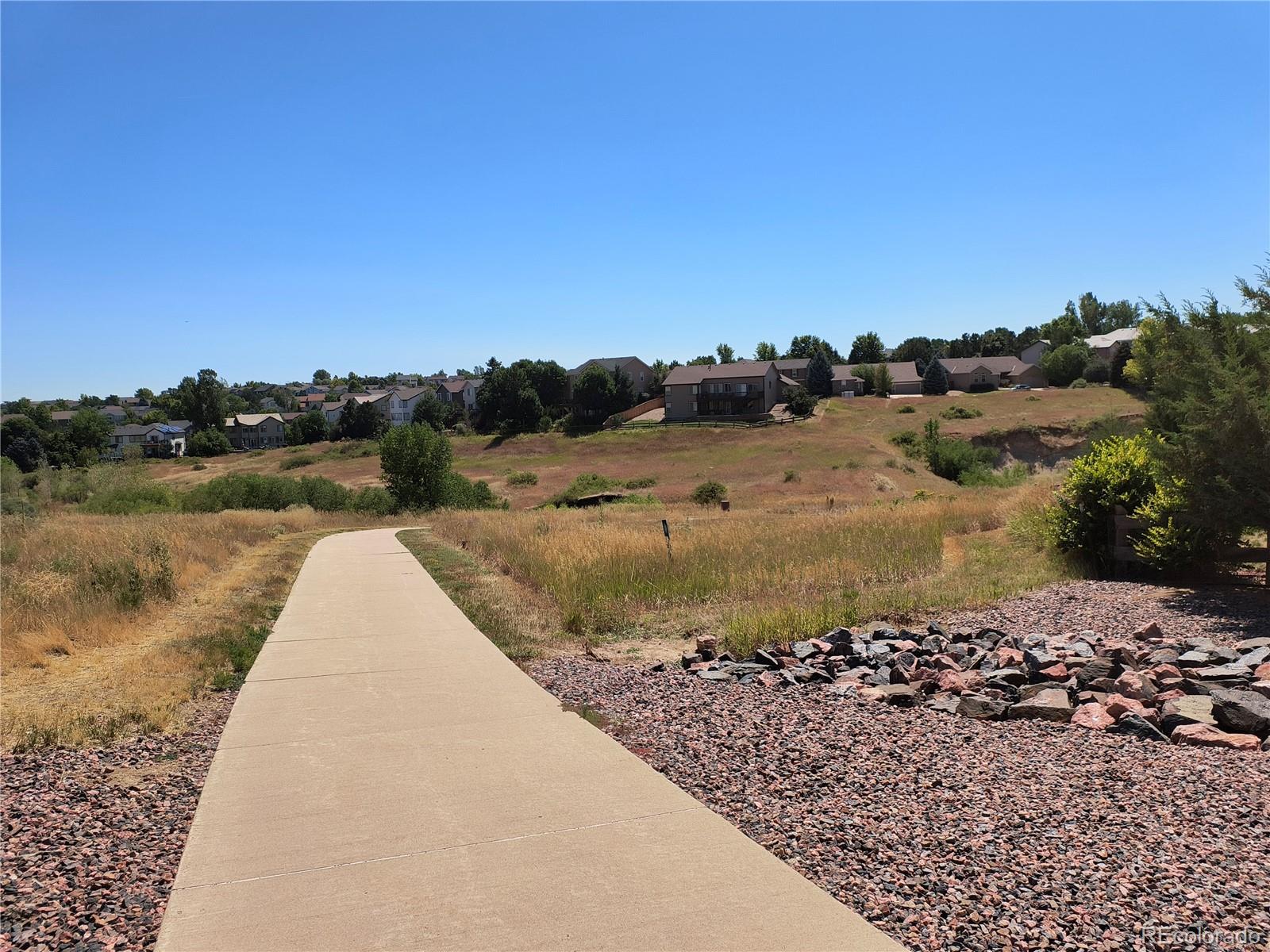 10145 Charissglen Lane Highlands Ranch, CO 80126 - Photo 39 of 39 a view of a lake with a mountain
