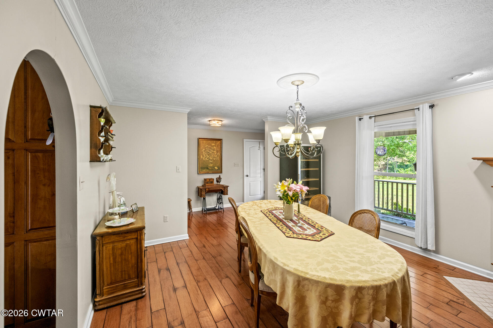 492 Joe Horton Road Lexington, TN 38351 - Photo 15 of 49 a living room with furniture a chandelier and wooden floor