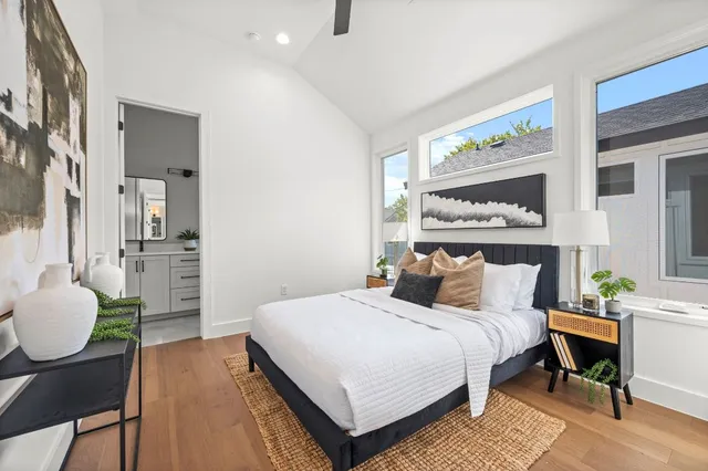 a bedroom with a bed and window