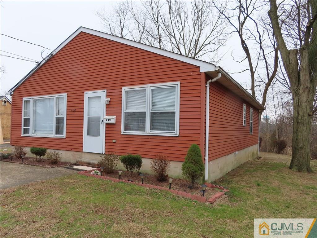 499 Harding Road Old Bridge, NJ 08879 - Photo 1 of 18 a front view of a house with a yard