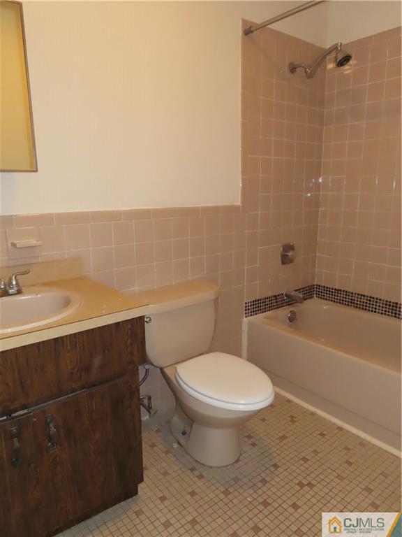 499 Harding Road Old Bridge, NJ 08879 - Photo 17 of 18 a bathroom with a sink a toilet and bathtub