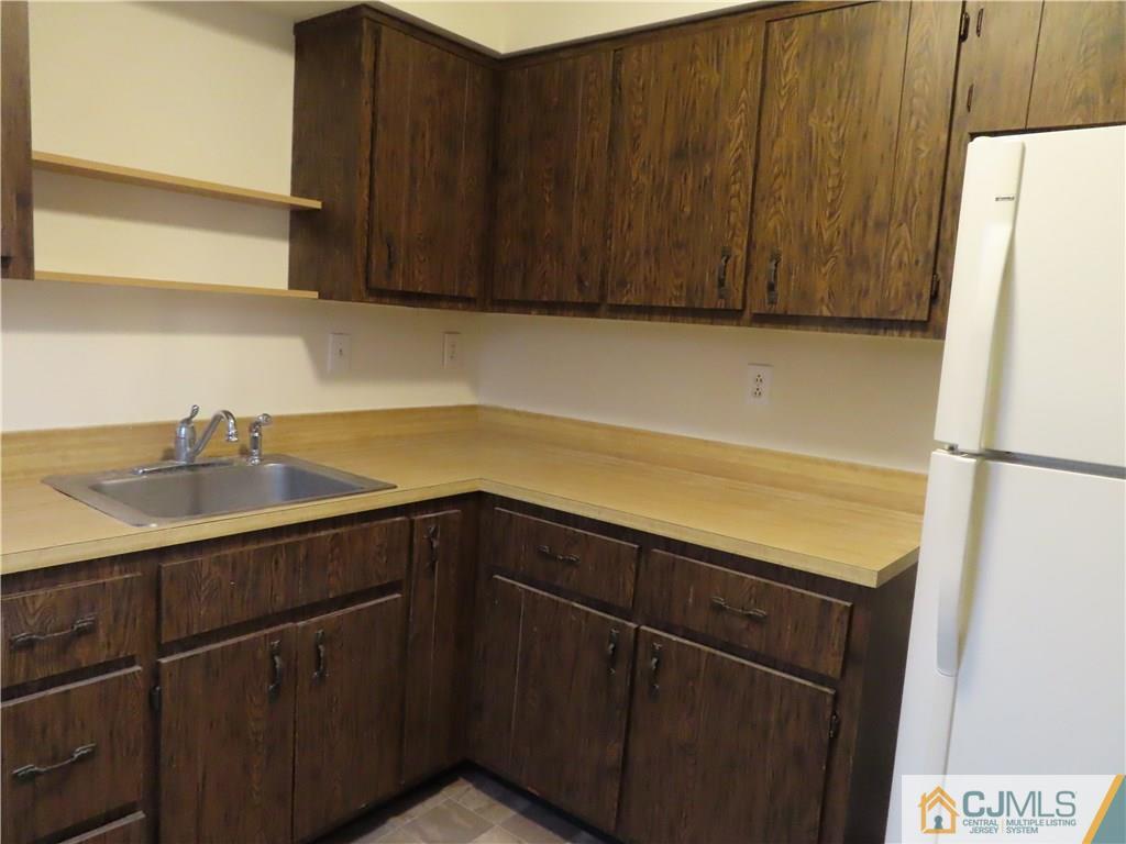 499 Harding Road Old Bridge, NJ 08879 - Photo 7 of 18 a kitchen with a sink and cabinets