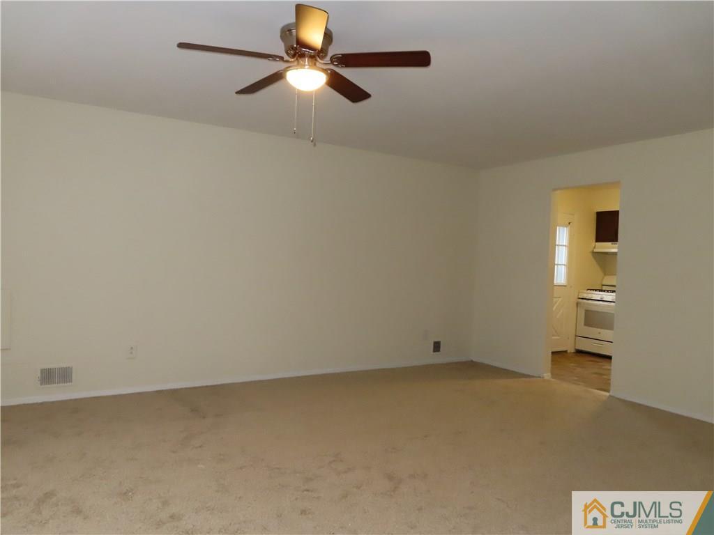 499 Harding Road Old Bridge, NJ 08879 - Photo 9 of 18 wooden floor in an empty room