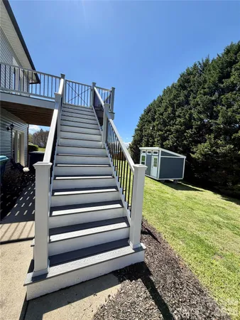 a view of a backyard with stairs plants