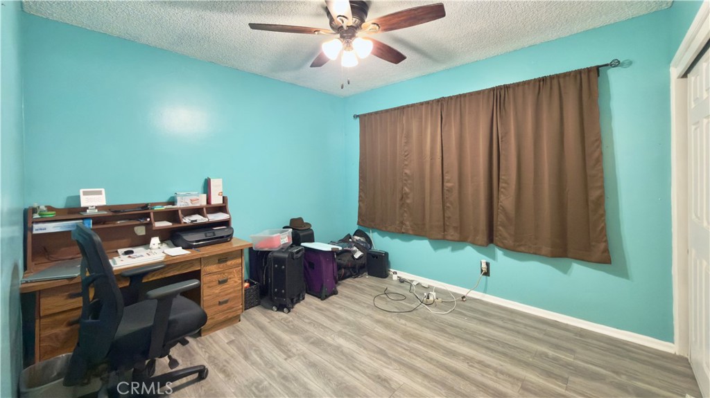 10861 Jamie Avenue Pacoima, CA 91331 - Photo 11 of 31 a bed room with furniture and a window