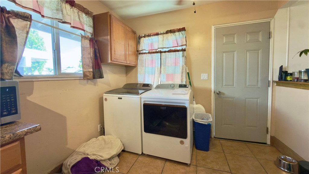 10861 Jamie Avenue Pacoima, CA 91331 - Photo 18 of 31 a bathroom with a stove a sink and a refrigerator