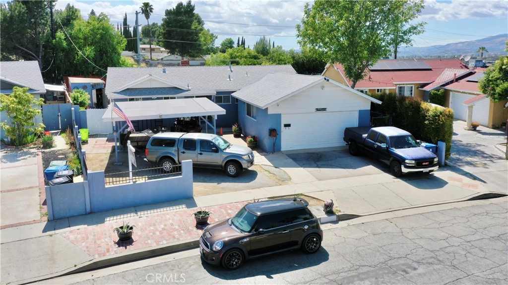 10861 Jamie Avenue Pacoima, CA 91331 - Photo 2 of 31 a car parked in front of a white house