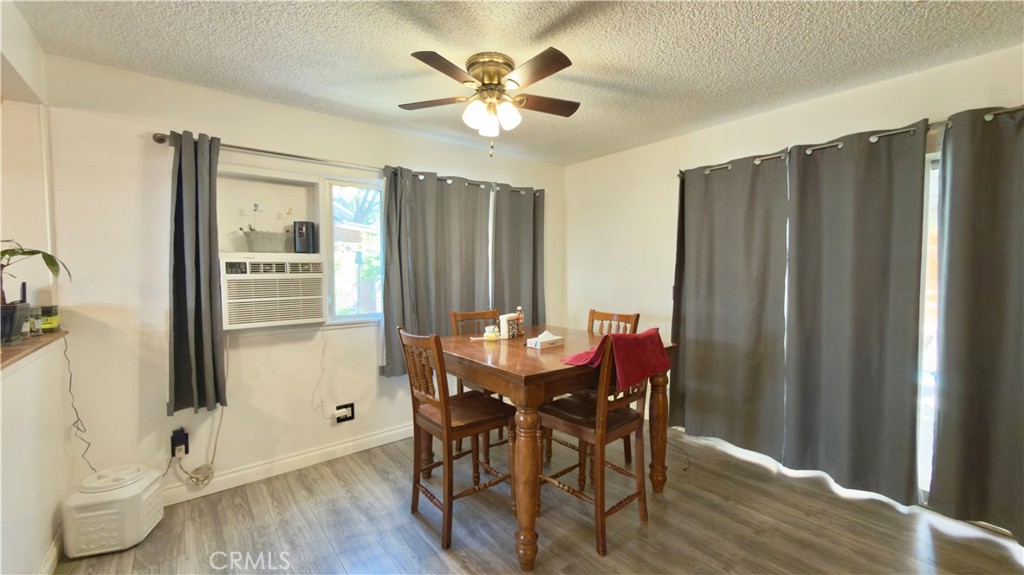 10861 Jamie Avenue Pacoima, CA 91331 - Photo 21 of 31 a view of a dining room with furniture and a window