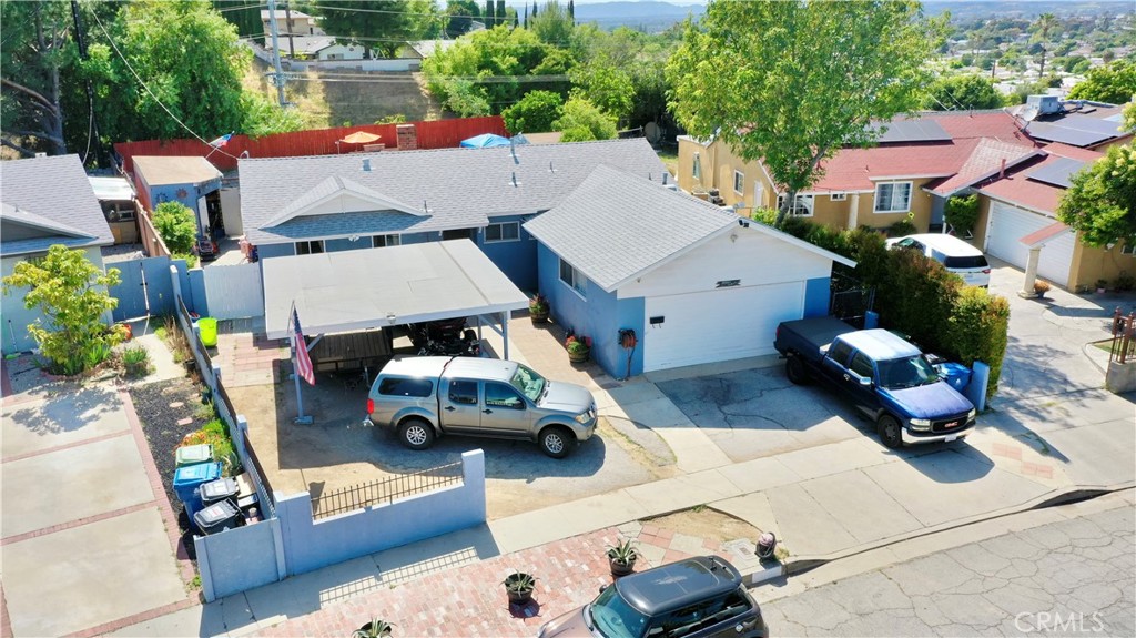10861 Jamie Avenue Pacoima, CA 91331 - Photo 23 of 31 an aerial view of a yard with table and chairs and potted plants