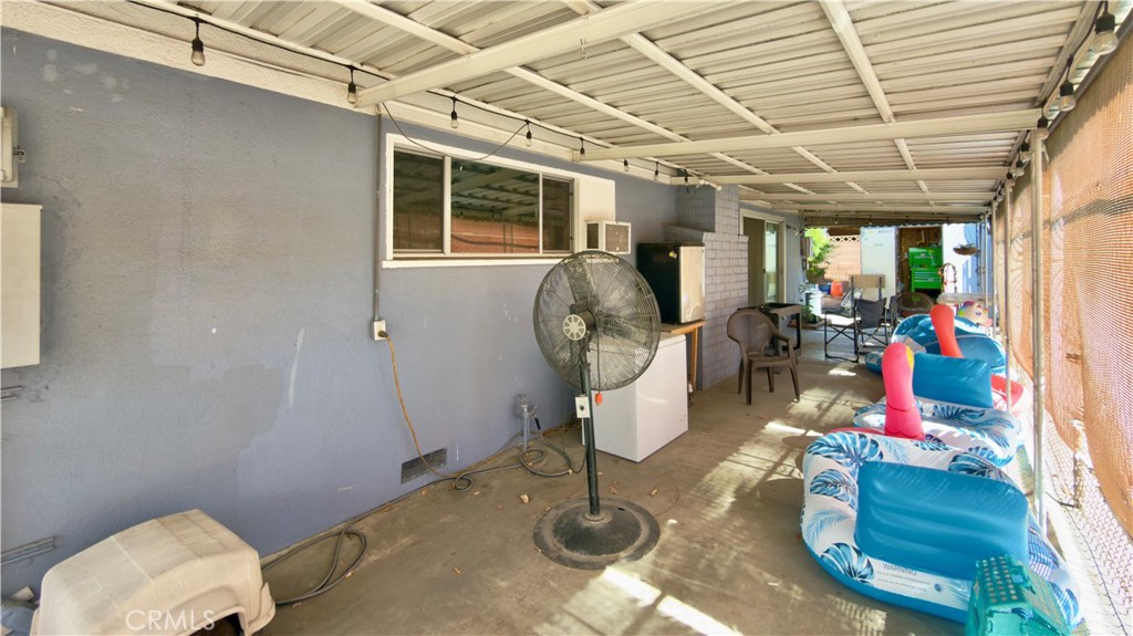 10861 Jamie Avenue Pacoima, CA 91331 - Photo 31 of 31 a room with lots of furniture and gym equipment