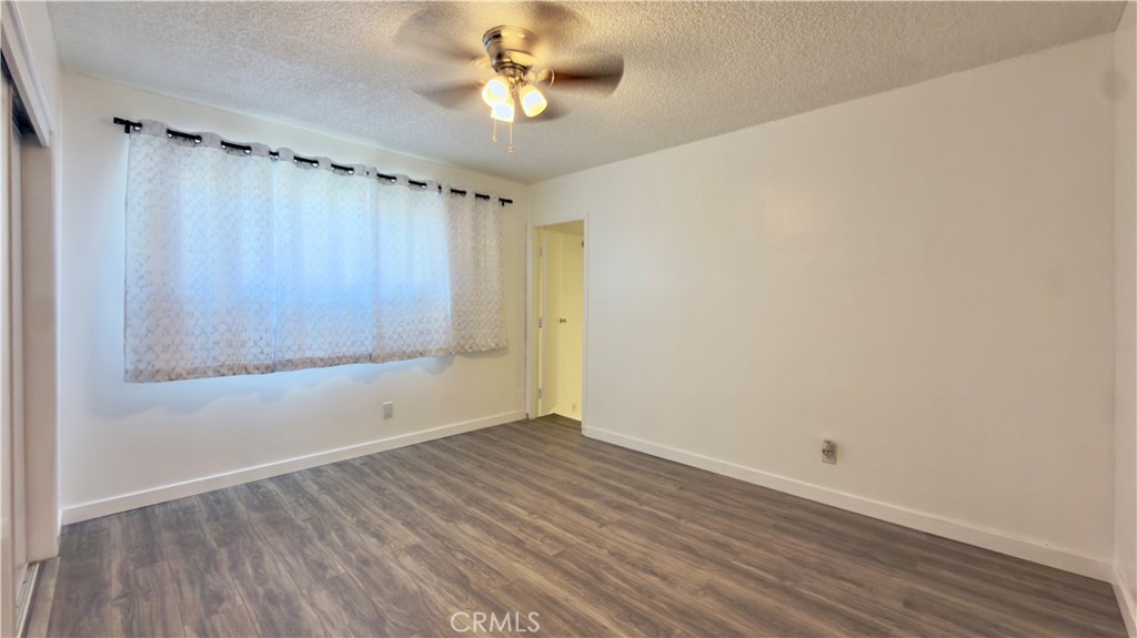 10861 Jamie Avenue Pacoima, CA 91331 - Photo 8 of 31 wooden floor in an empty room