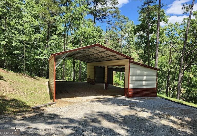 333 Venture Trail Sparta, GA 31087 - Photo 14 of 16 a view of a house with a yard
