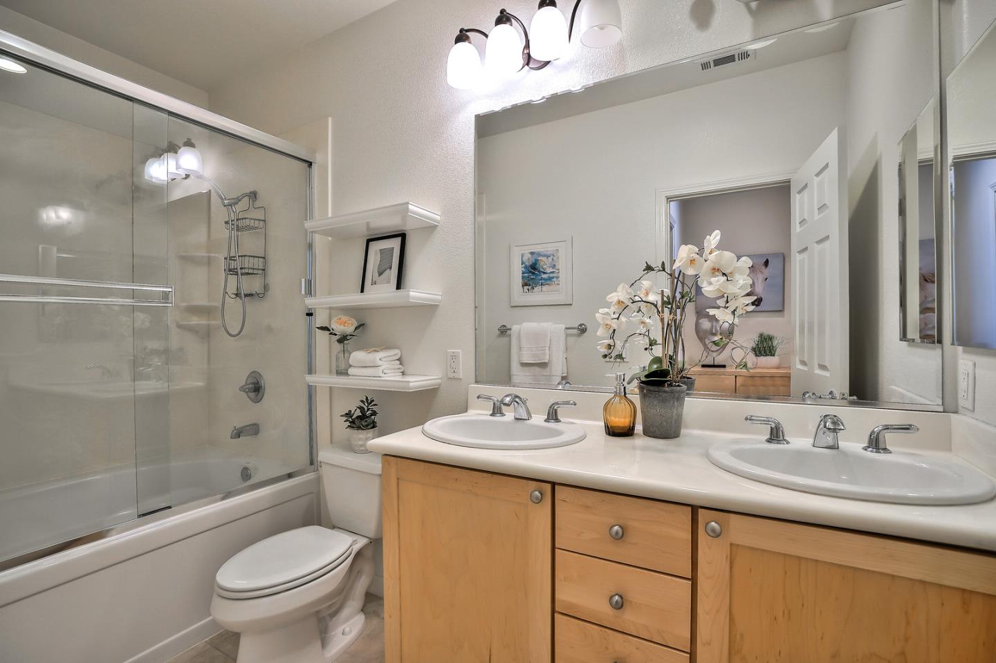 1088 Vida Larga Loop Milpitas, CA 95035 - Photo 16 of 29 a bathroom with a granite countertop sink toilet and shower