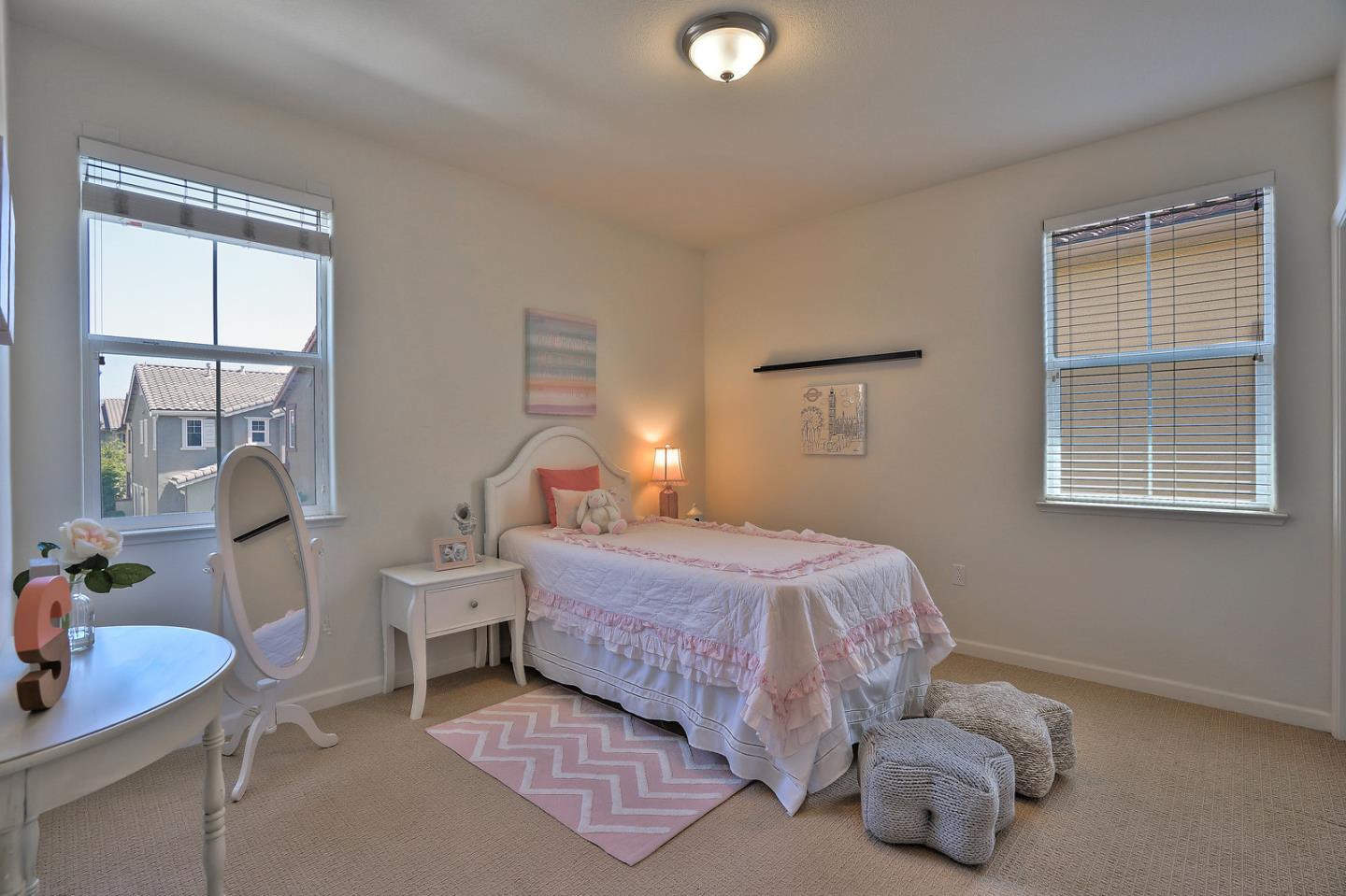 1088 Vida Larga Loop Milpitas, CA 95035 - Photo 17 of 29 a bedroom with a bed and a table