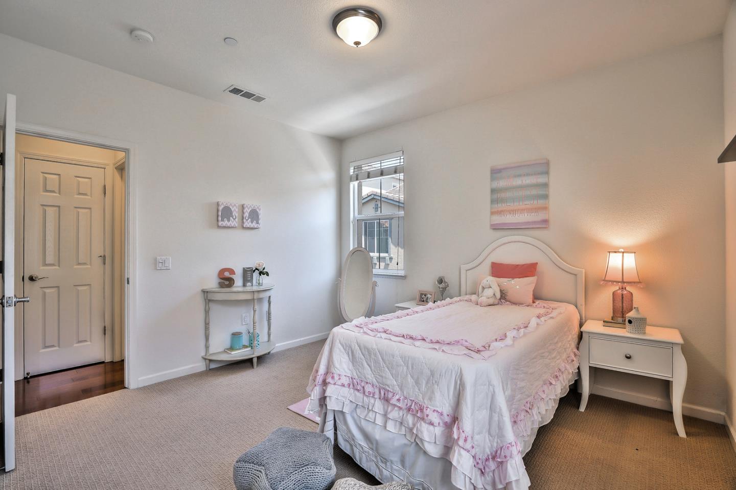 1088 Vida Larga Loop Milpitas, CA 95035 - Photo 18 of 29 a bedroom with a bed and a lamp on dresser