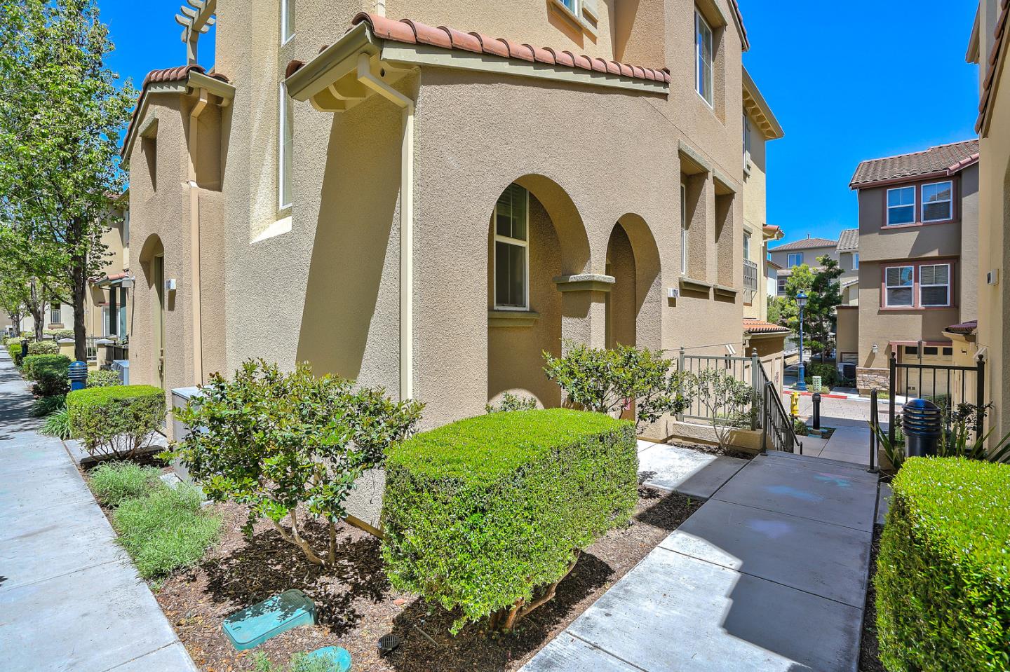 1088 Vida Larga Loop Milpitas, CA 95035 - Photo 2 of 29 a front view of a house with garden