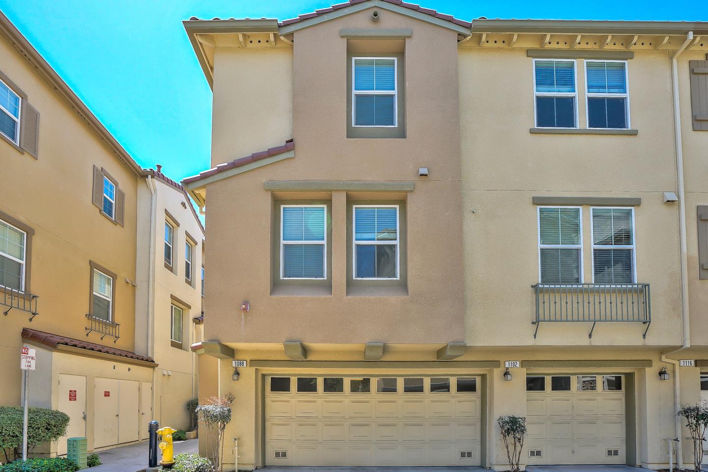 1088 Vida Larga Loop Milpitas, CA 95035 - Photo 23 of 29 a front view of a building with glass windows