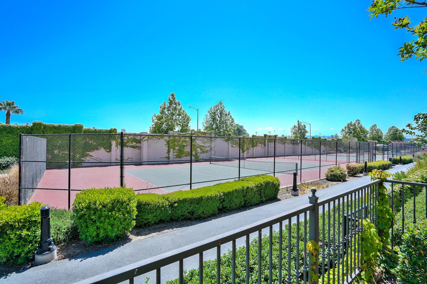 1088 Vida Larga Loop Milpitas, CA 95035 - Photo 26 of 29 a view of a garden with a building in the background